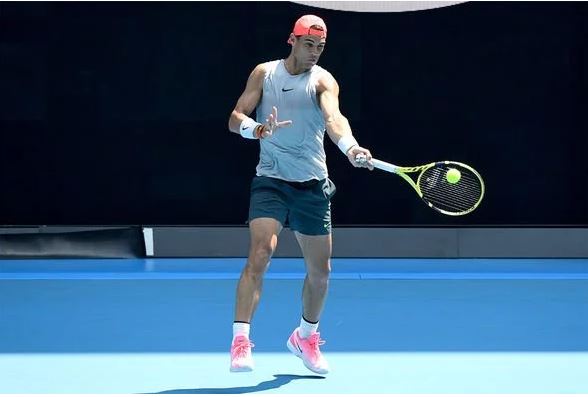 Rafael Nadal holds racket