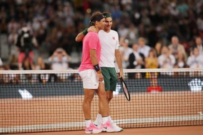 Rafael Nadal and Roger Federer walk