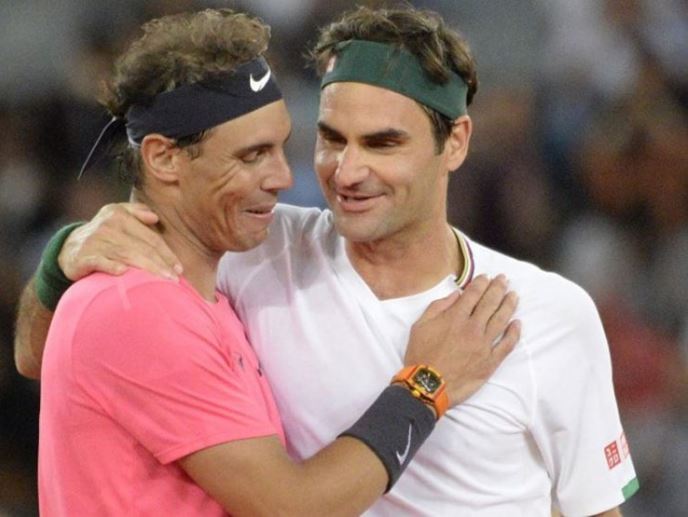Rafael Nadal hold Roger Federer