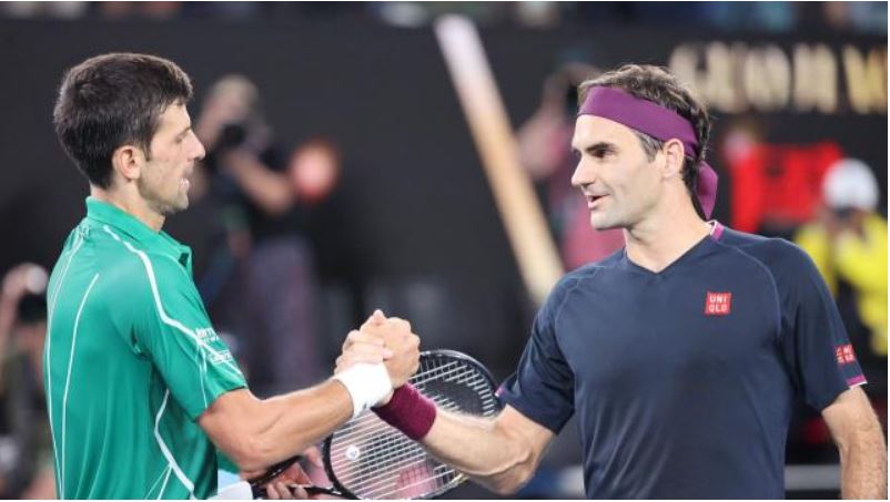 Roger Federer shake Novak Djokovic