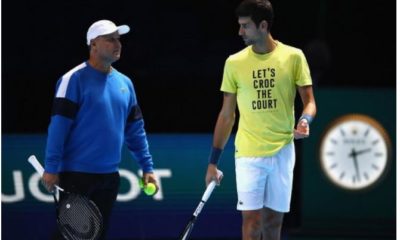 Novak Djokovic and coach walk