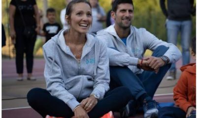 Novak Djokovic and wife sit