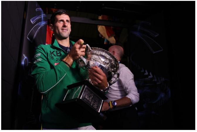 Novak Djokovic holding trophy