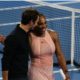 Roger Federer and Serena Williams walk