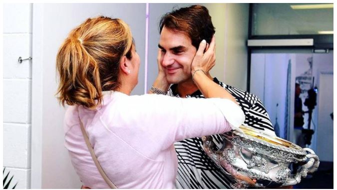 Roger Federer holds wife