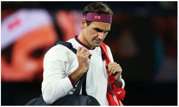 Roger Federer with bag