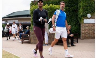 Serena Williams walking with coach