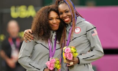 Serena and Venus Williams after winning the Women's Doubles gold medal at the London Olympics in 2012
