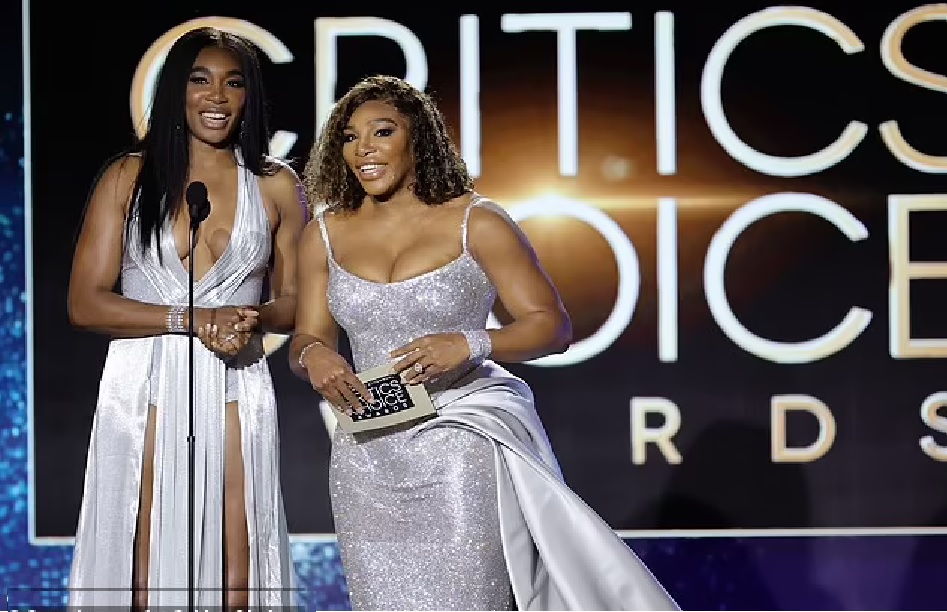 Serena and Venus Williams flashed bright smiles for the warm welcome as their crystal gowns sparkled in the spotlight