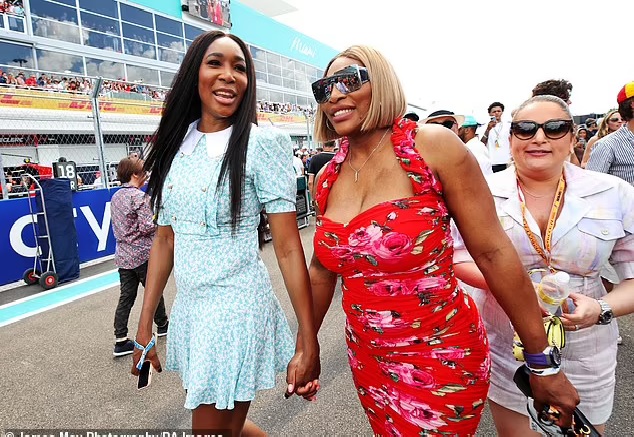 Serena and Venus Williams appeared to be in good spirits as they walked hand-in-hand at the Miami Grand Prix